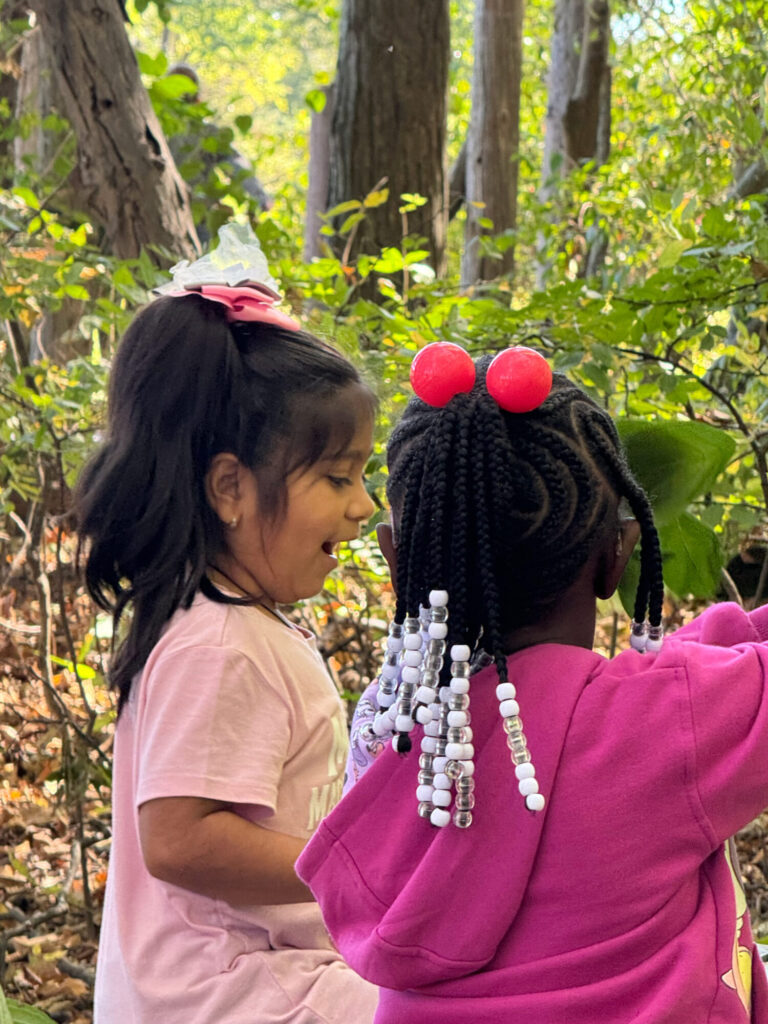 Kids play outside in the AEP Nature Explore Classroom in Fort Wayne, Ind.